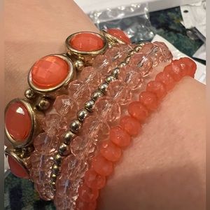 Gold accented coral stacking bracelets